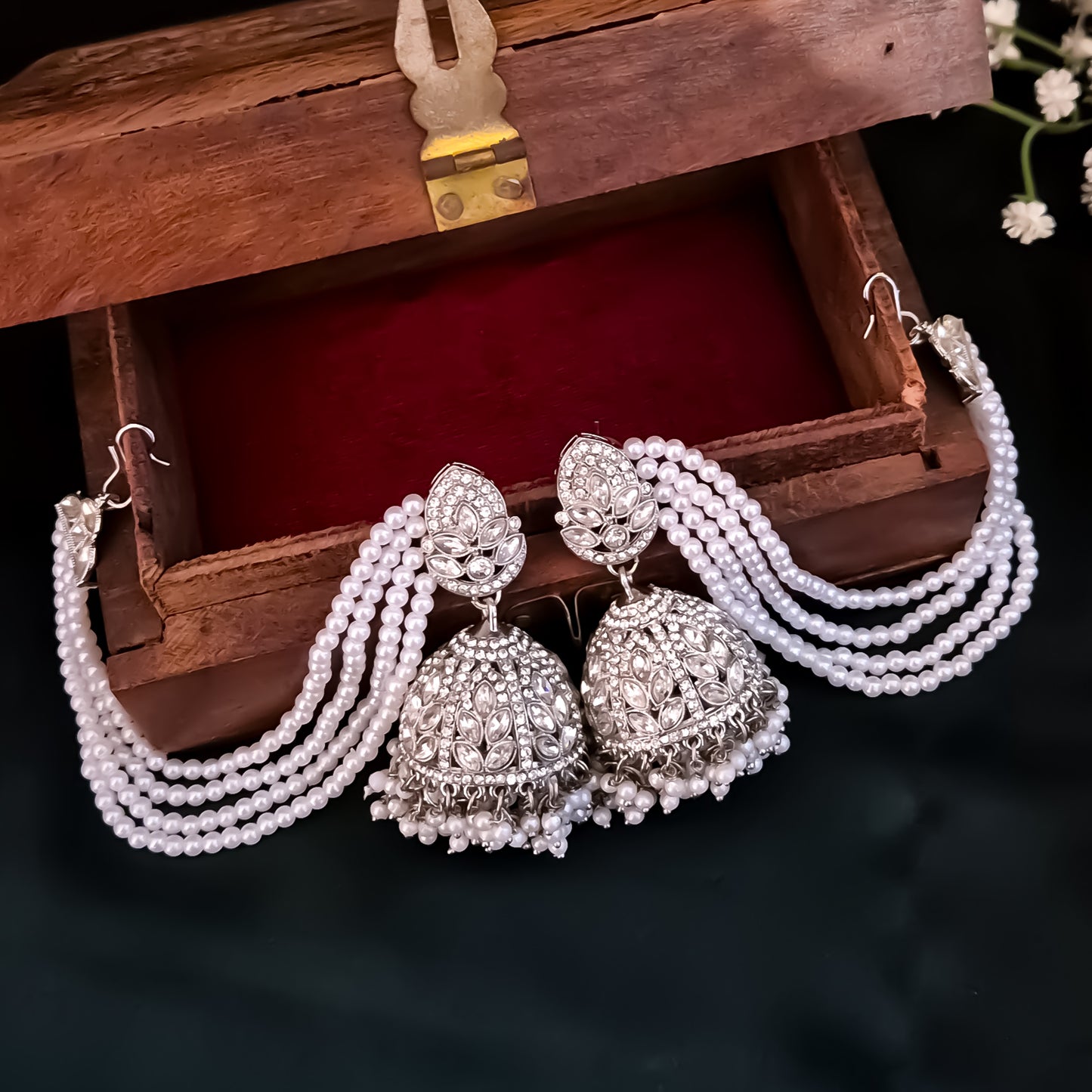 Kareena Rhodium Reverse AD Jhumka Earrings with Earchain - Silver