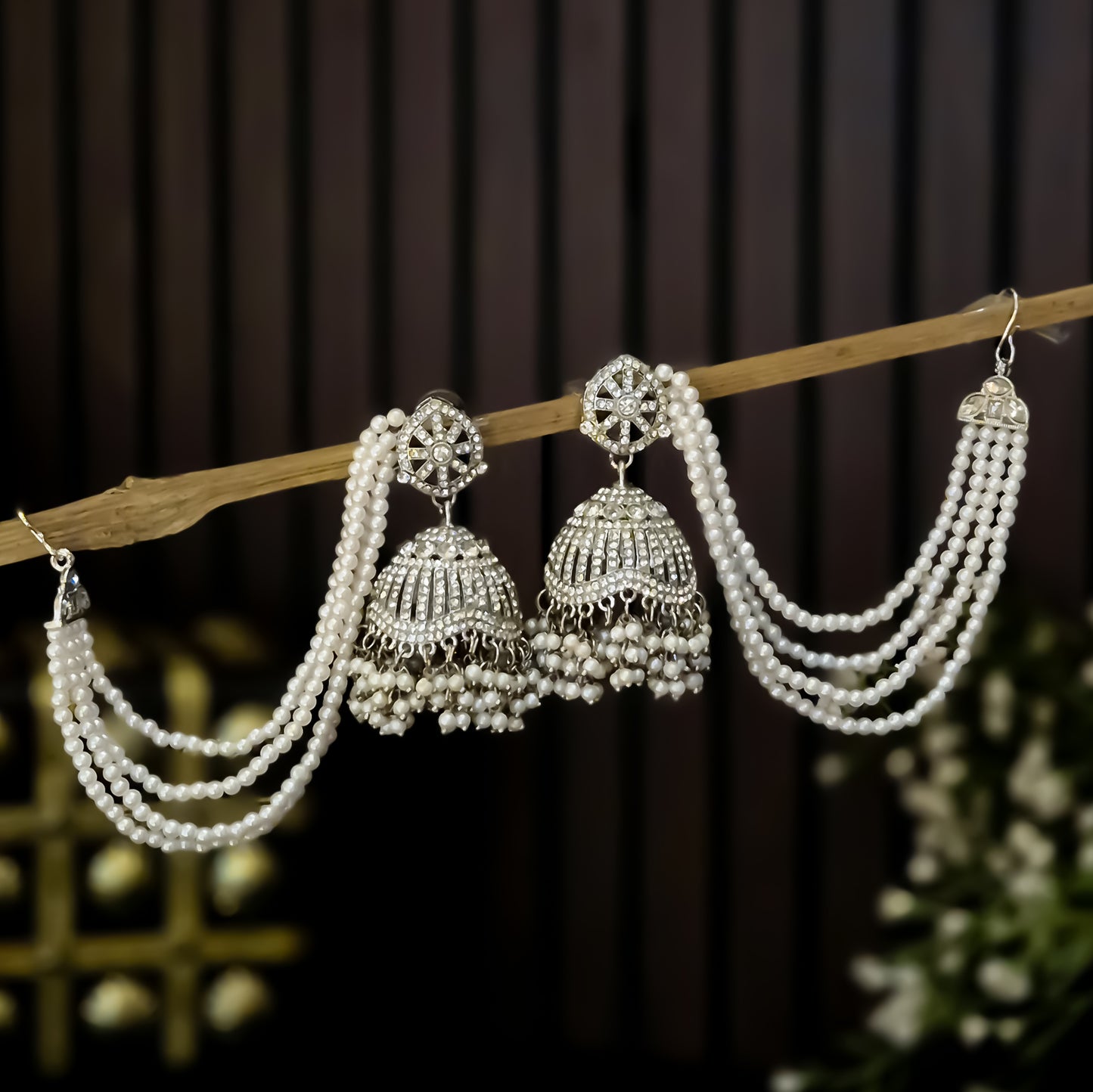 Sabrina Rhodium Reverse AD Jhumka Earrings with Earchain - Silver