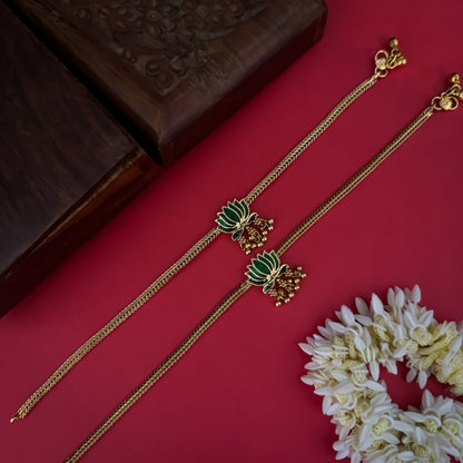 Lotus Bairagi premium antique gold temple anklet pair featuring flexible double strand woven rope chains a hand painted pink meenakari lotus flower centerpiece and dangling gold ghungroo bell clusters