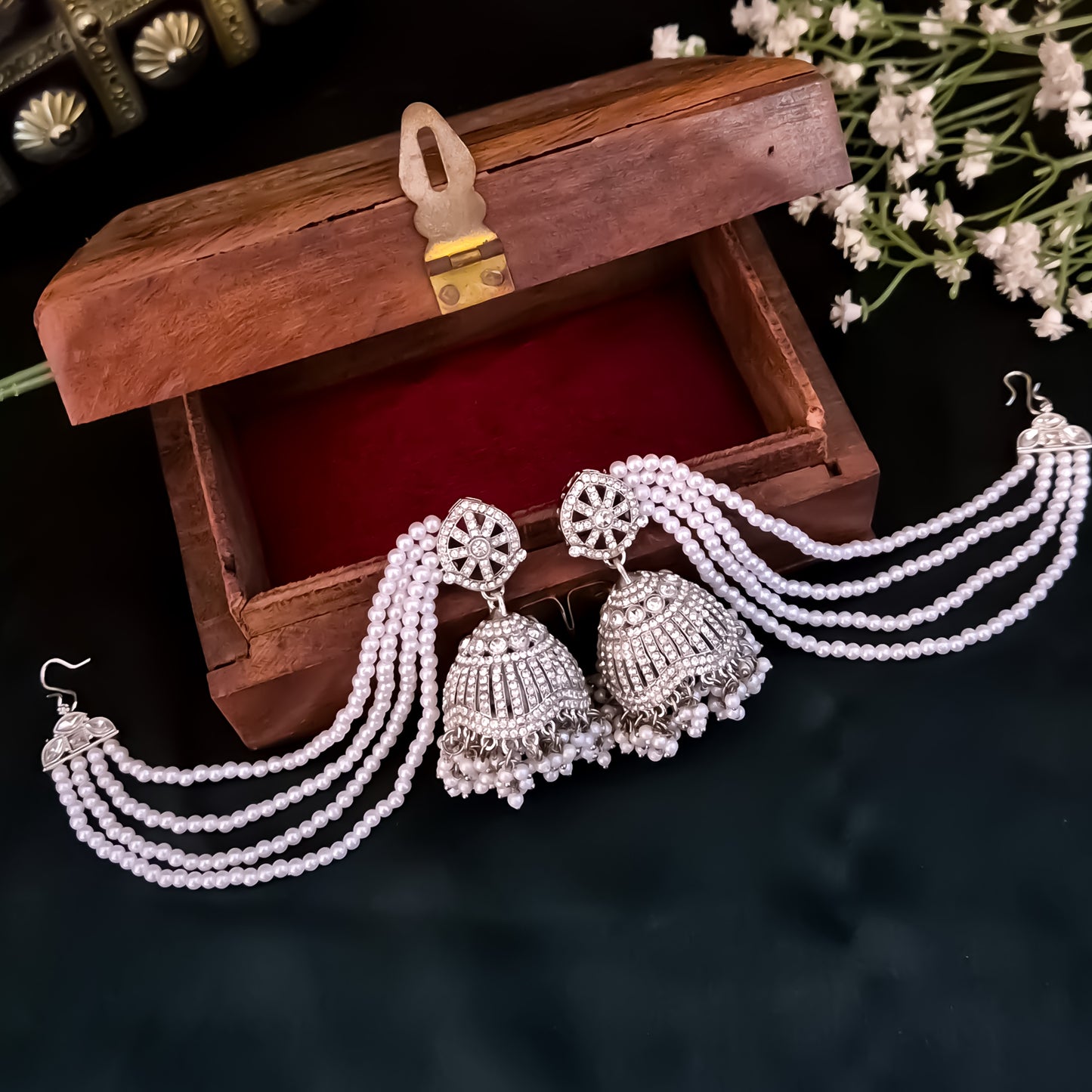 Sabrina Rhodium Reverse AD Jhumka Earrings with Earchain - Silver