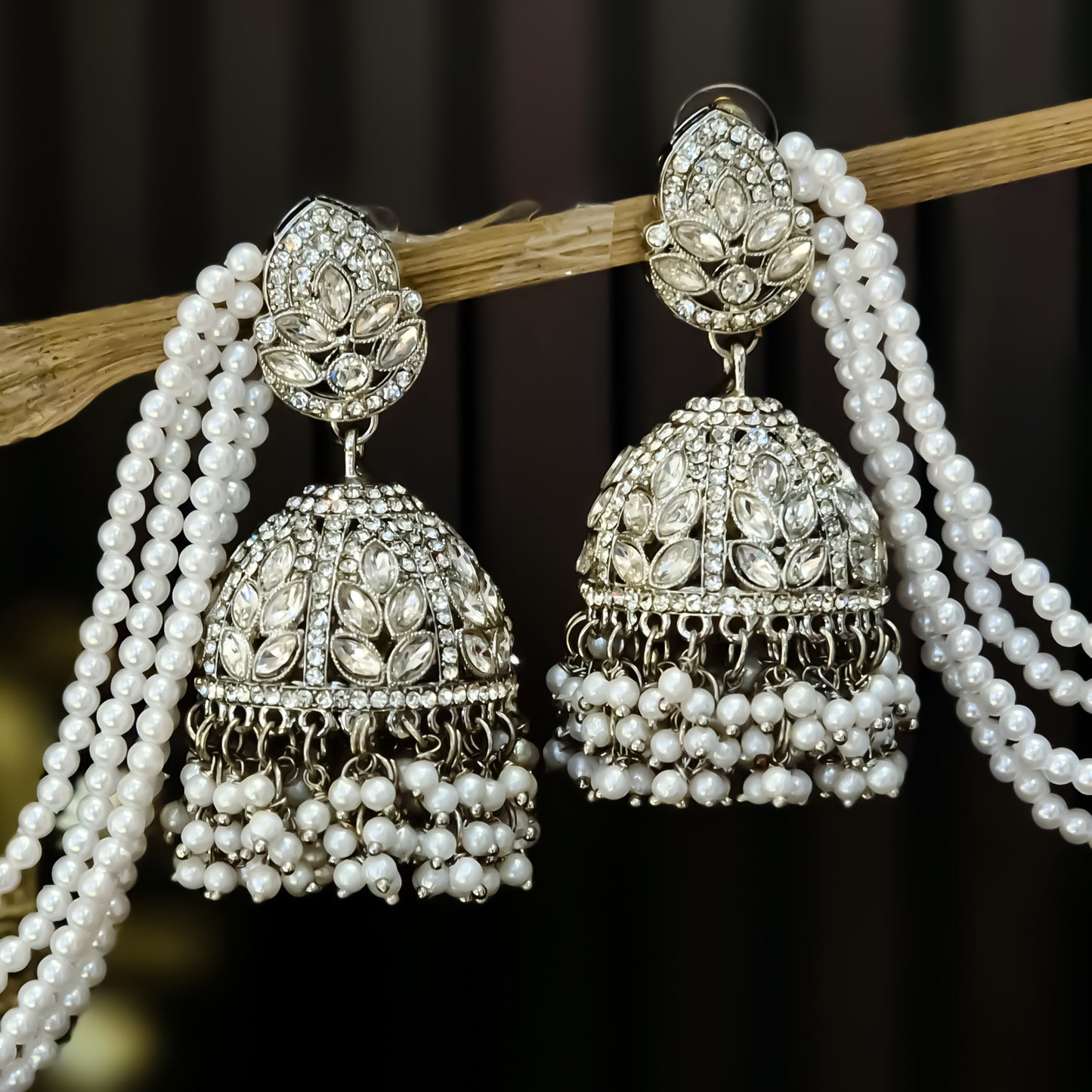 Kareena Rhodium Reverse AD Jhumka Earrings with Earchain - Silver