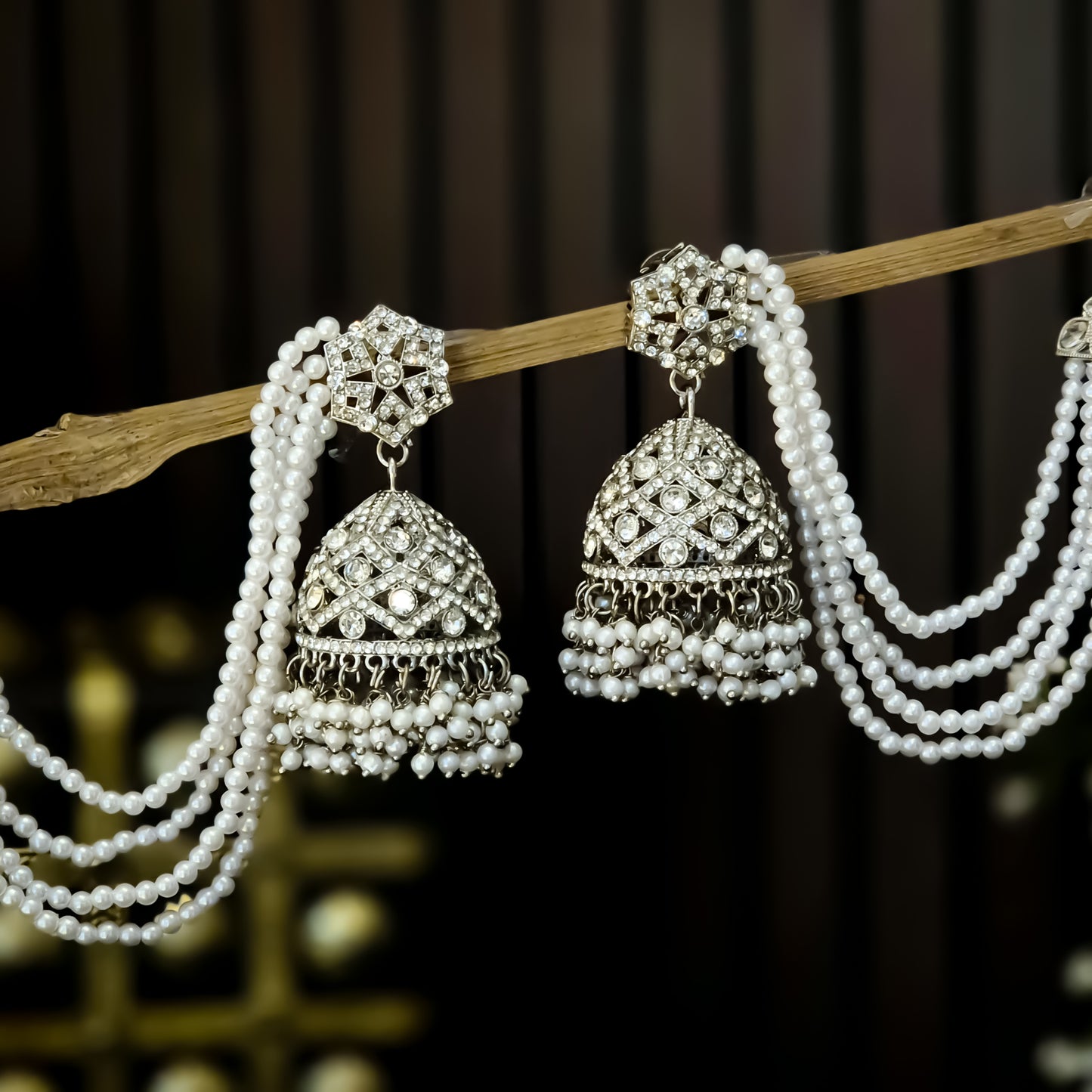 Rihana Rhodium Reverse AD Jhumka Earrings with Earchain - Silver