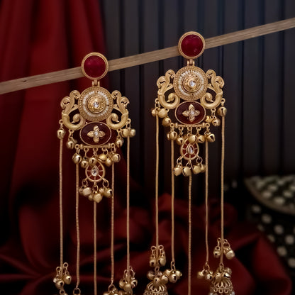 haya premium matte gold kashmiri earrings featuring round ruby studs openwork peacock filigree shields quatrefoil maroon enamel medallions and five long dangling gold chains ending in micro pearl jhumkas