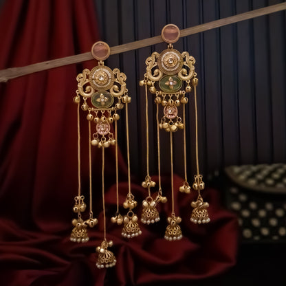 Chaya premium matte gold kashmiri earrings featuring round ruby studs openwork peacock filigree shields quatrefoil maroon enamel medallions and five long dangling gold chains ending in micro pearl jhumkas