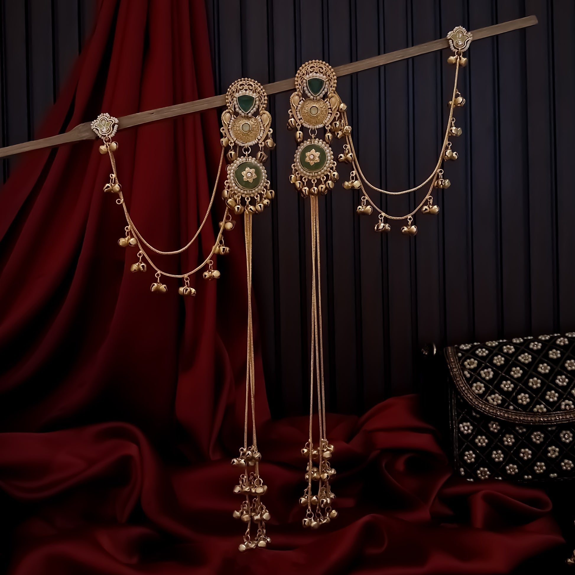 Yukti premium matte gold kashmiri earrings featuring ruby meenakari teardrop studs dual circular medallions white pearl frames long vertical ghungroo tassel chains and a detachable double strand bell sahara hair chain