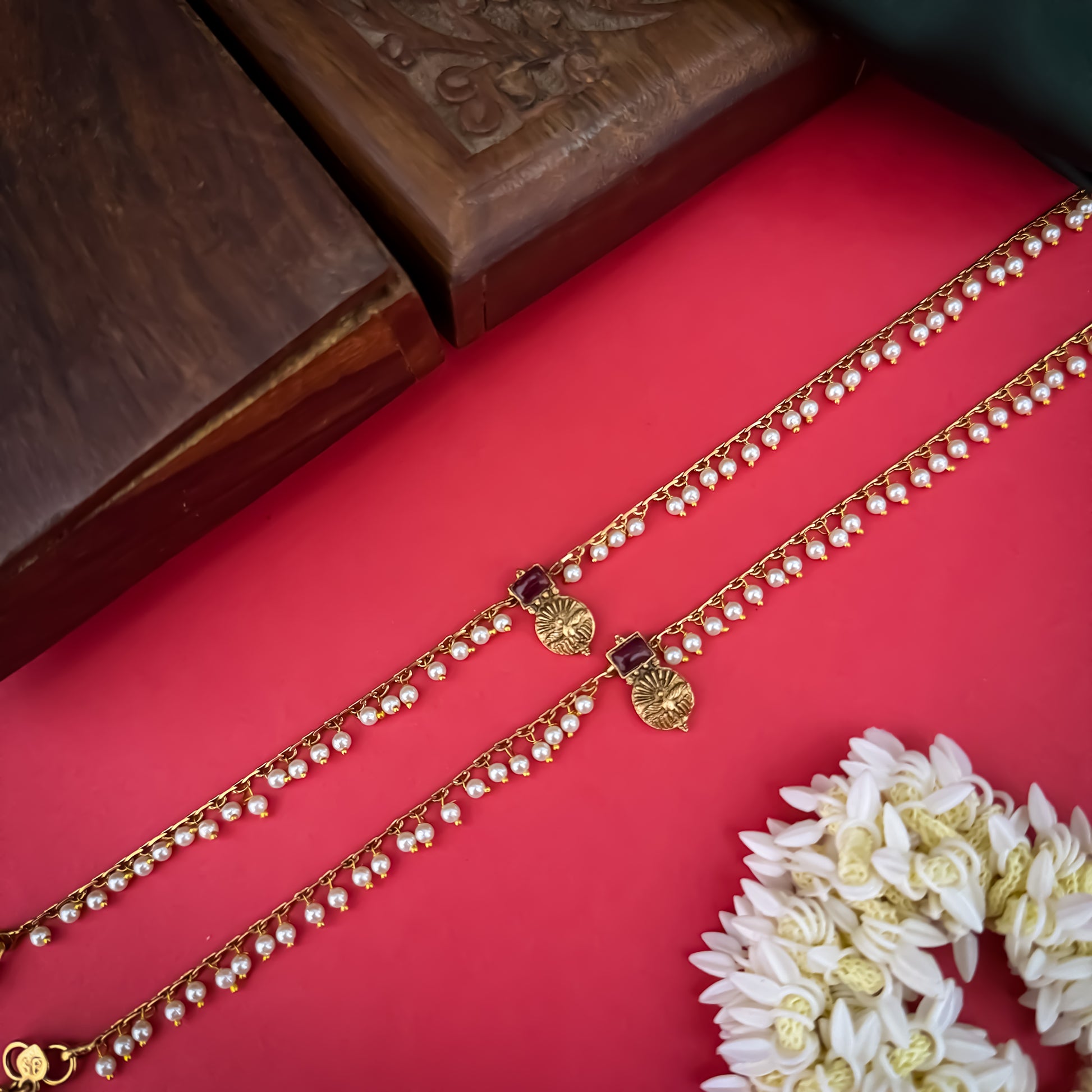 Floral Temple premium antique gold anklet pair featuring flexible double strand woven chain bands linked circular ruby pink and green kemp stone rosettes and cascading gold ghungroo fringes