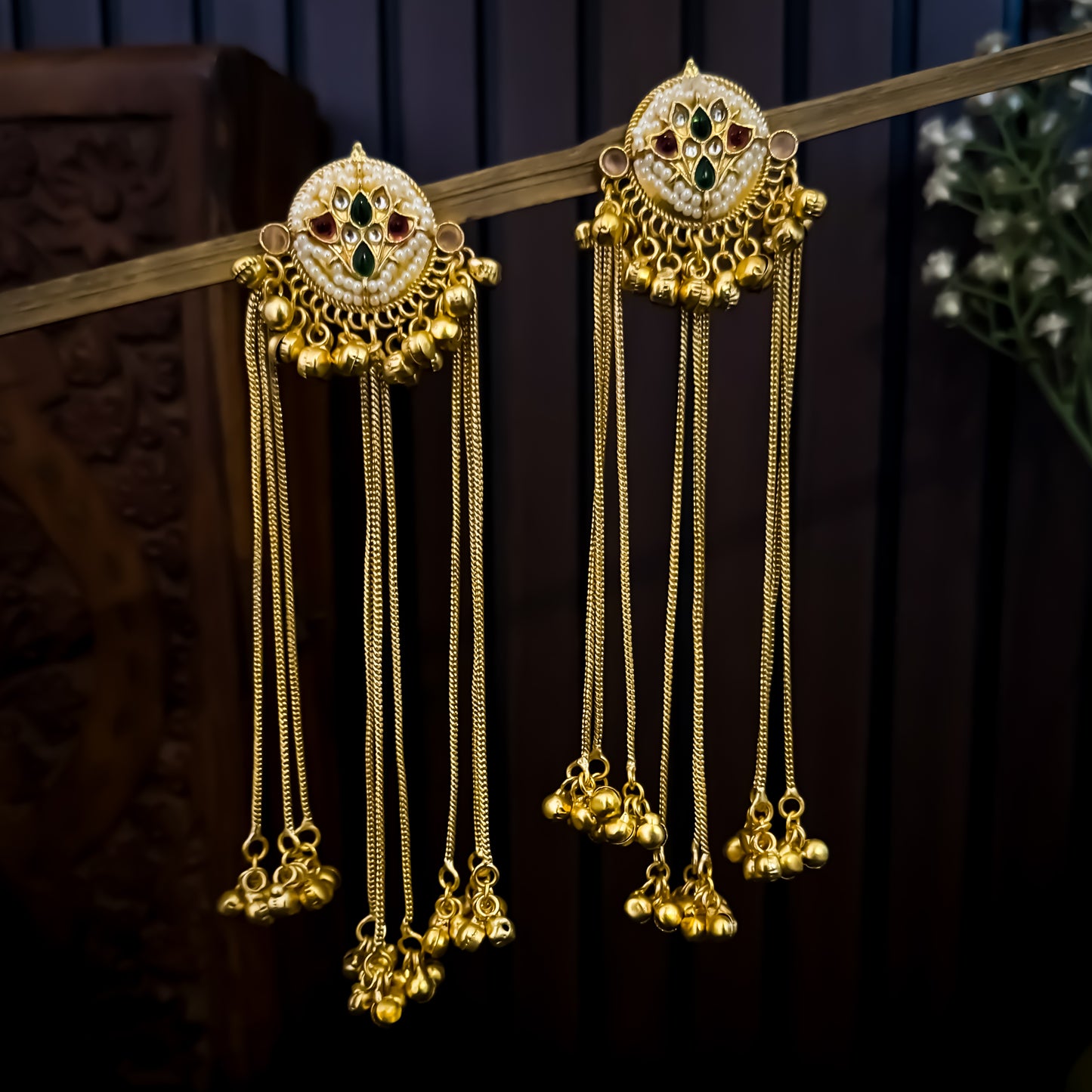 Nida premium kashmiri brass earrings featuring circular kundan studs with pink and green stones and long cascading gold ghungroo chains