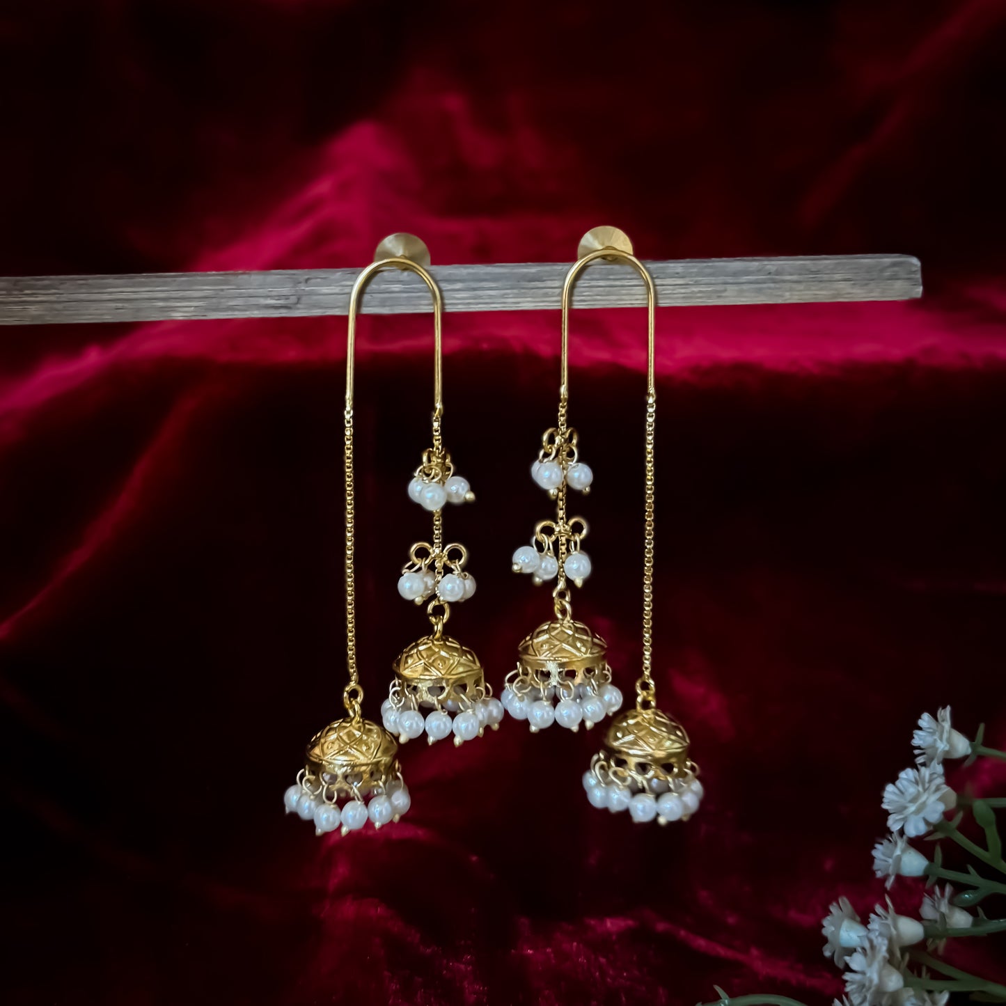 Isha Premium Kashmiri Brass Earrings featuring an elongated gold ear wire hook hanging two front tiered jhumka domes linked with pearls and a longer rear chain dome with a dense micro pearl fringe