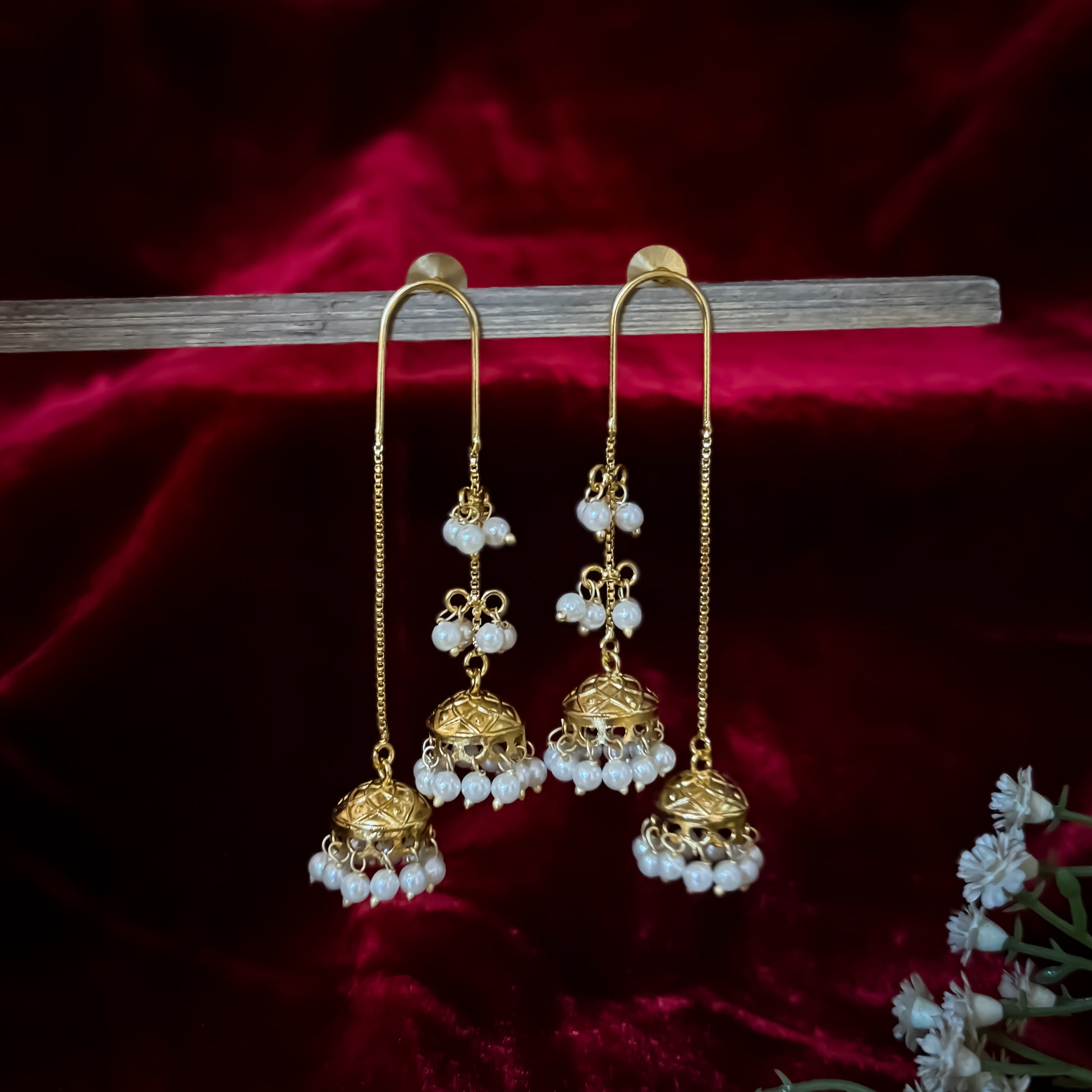 Isha Premium Kashmiri Brass Earrings featuring an elongated gold ear wire hook hanging two front tiered jhumka domes linked with pearls and a longer rear chain dome with a dense micro pearl fringe