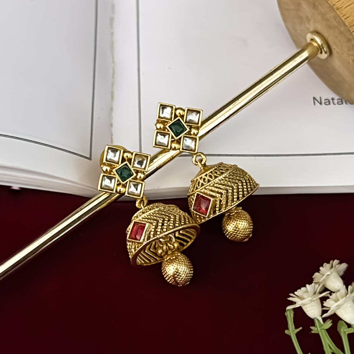premium antique gold kundan necklace set featuring a multi strand tracking of white pearls and green beads a large central circular medallion with red and green stones and matching rectangular tiered drop earrings