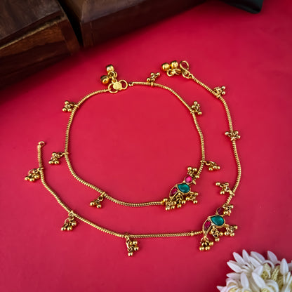 Floral Temple premium antique gold anklet pair featuring flexible double strand woven chain bands linked circular ruby pink and green kemp stone rosettes and cascading gold ghungroo fringes