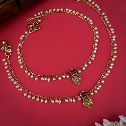 Floral Temple premium antique gold anklet pair featuring flexible double strand woven chain bands linked circular ruby pink and green kemp stone rosettes and cascading gold ghungroo fringes