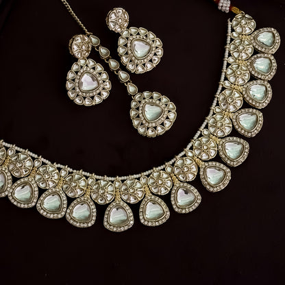 Hemakshi Golden Kundan Neckalce Set with Earrings & Teeka