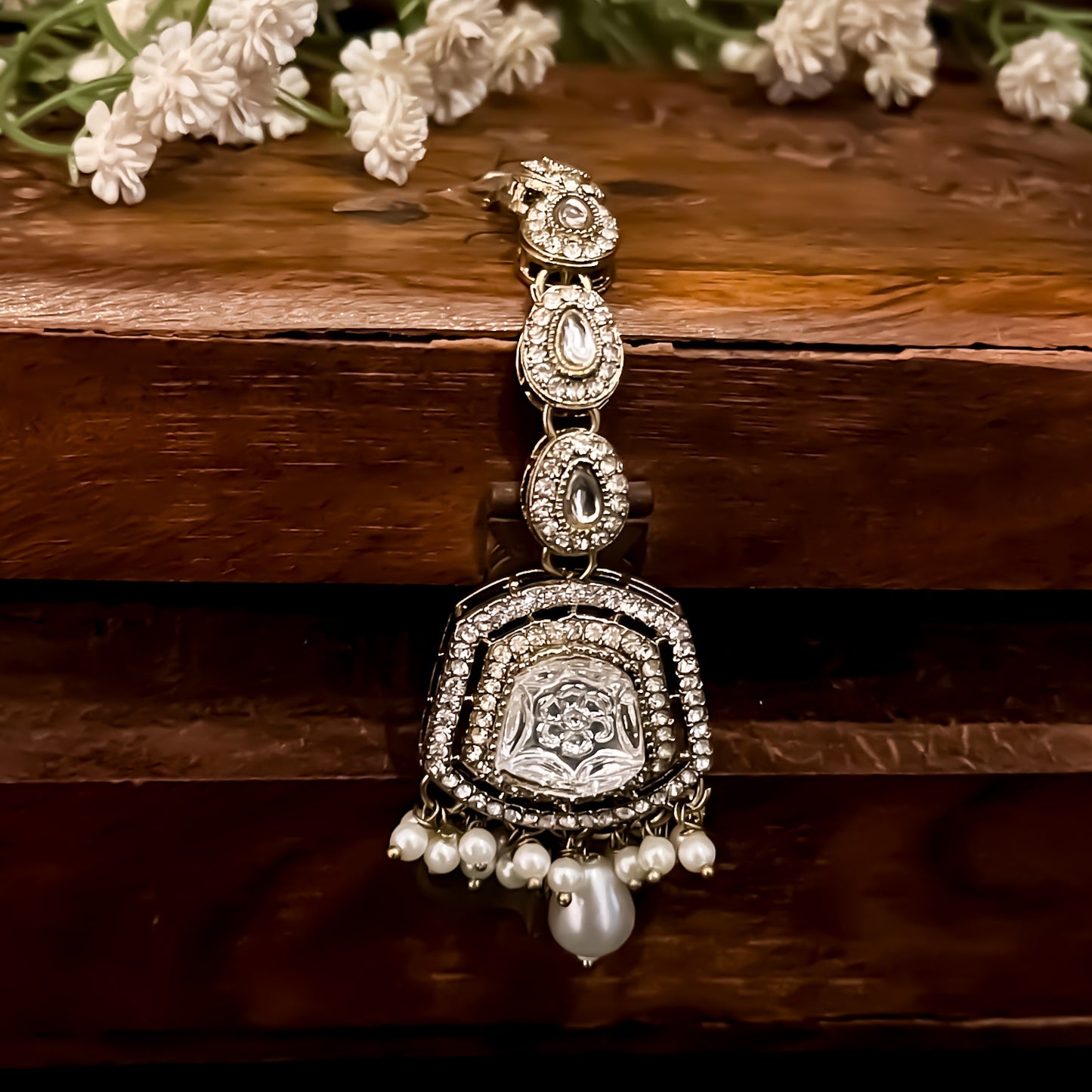 Ranjheya premium antique golden shield shaped jhumka earrings with carved flower mirrors clear cz pave borders and matching maang teeka set