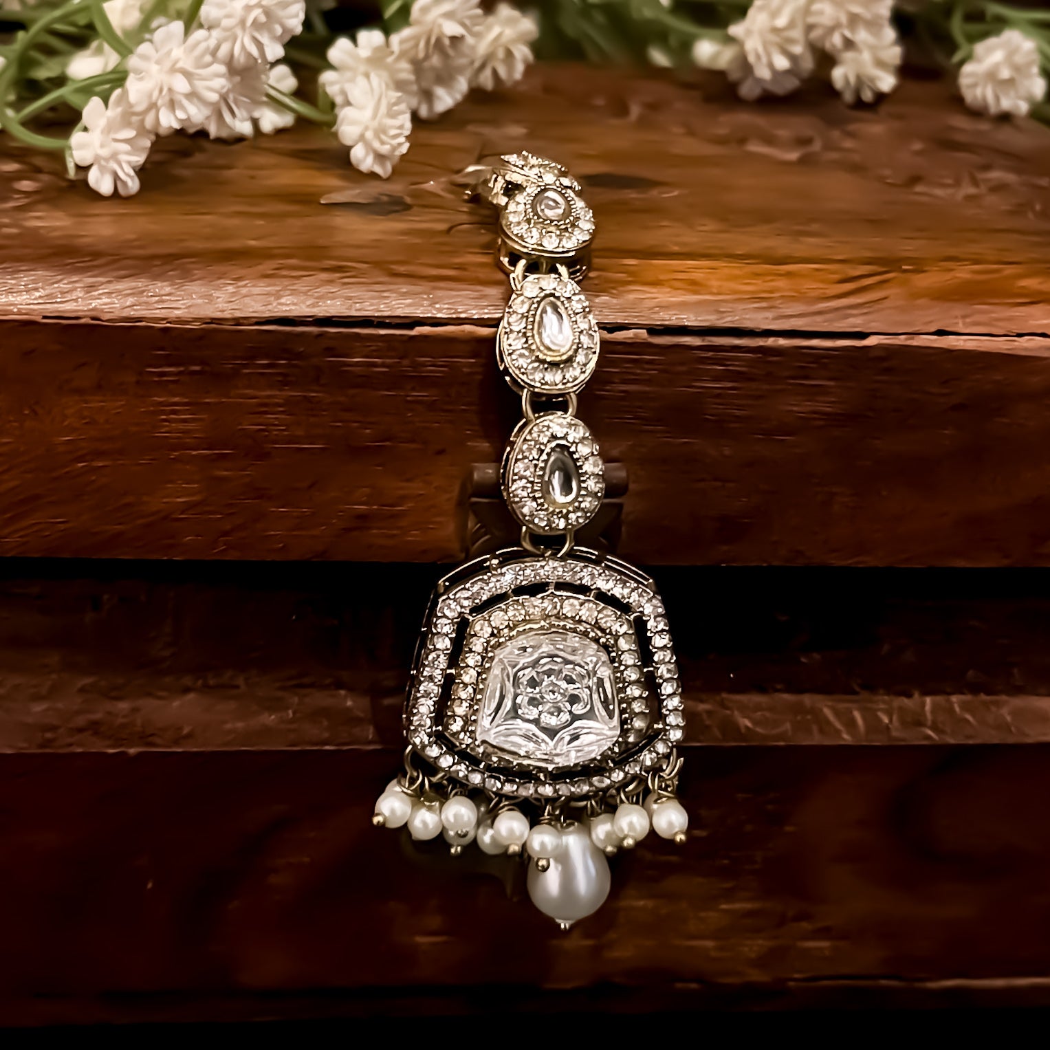 Ranjheya premium antique golden shield shaped jhumka earrings with carved flower mirrors clear cz pave borders and matching maang teeka set