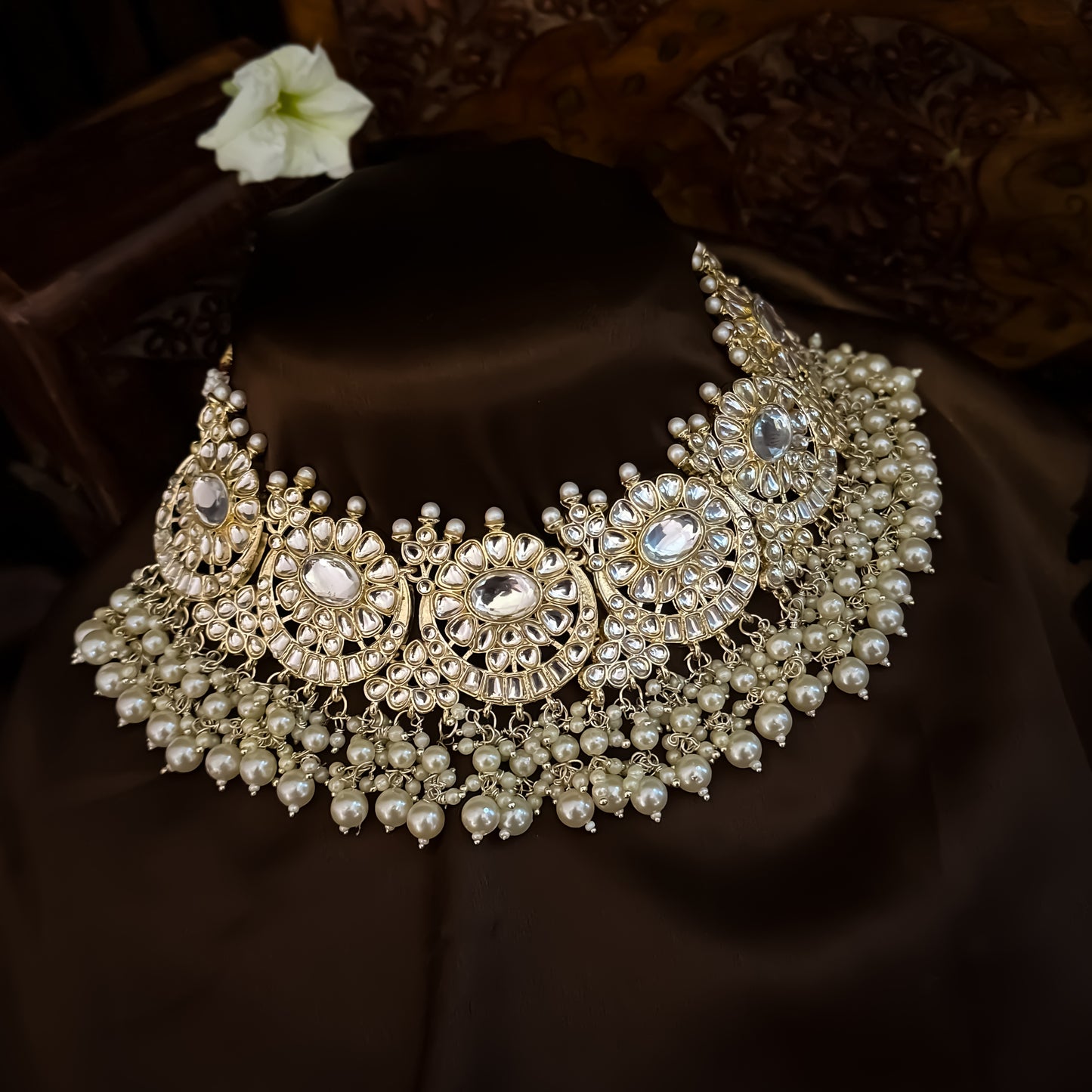 Afreen premium antique gold kundan broad choker necklace set featuring a linear linked tracking of crescent chandbali medallions dense white cluster pearl fringes matching chandelier earrings and maang tikka