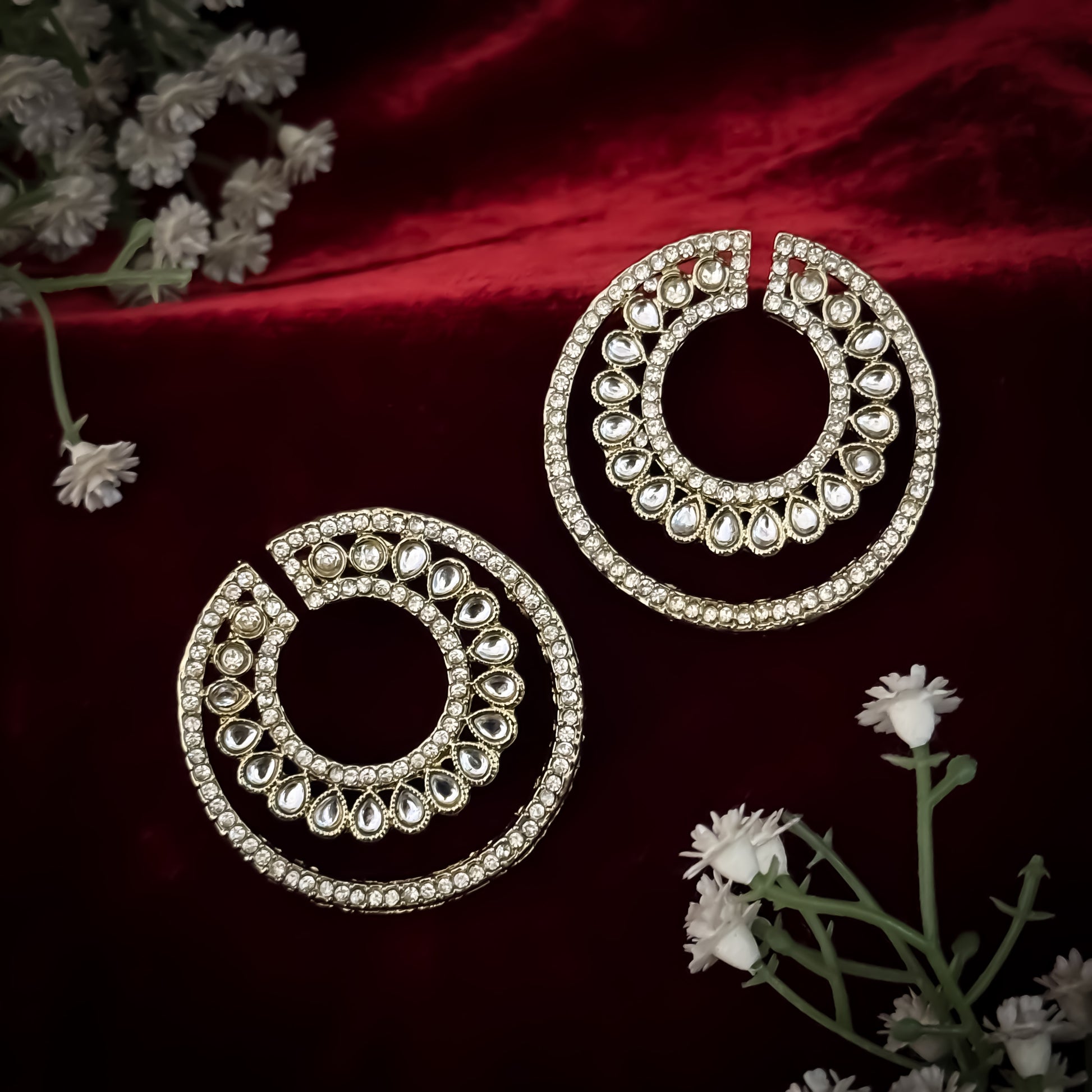 Rabiya premium antique gold kundan statement stud earrings featuring an open crescent circular geometry with concentric halos of teardrop stones and clear pavé crystals
