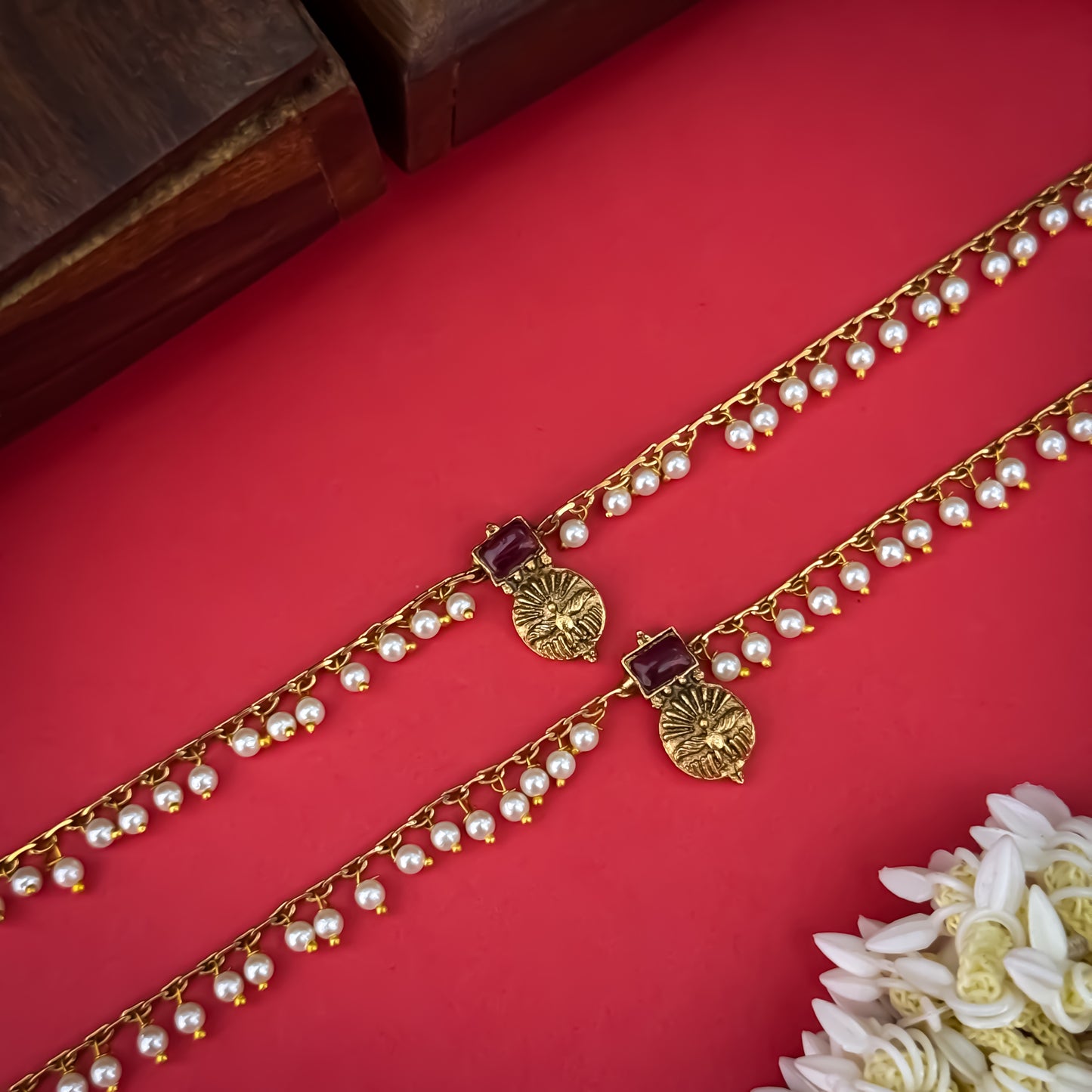 Floral Temple premium antique gold anklet pair featuring flexible double strand woven chain bands linked circular ruby pink and green kemp stone rosettes and cascading gold ghungroo fringes