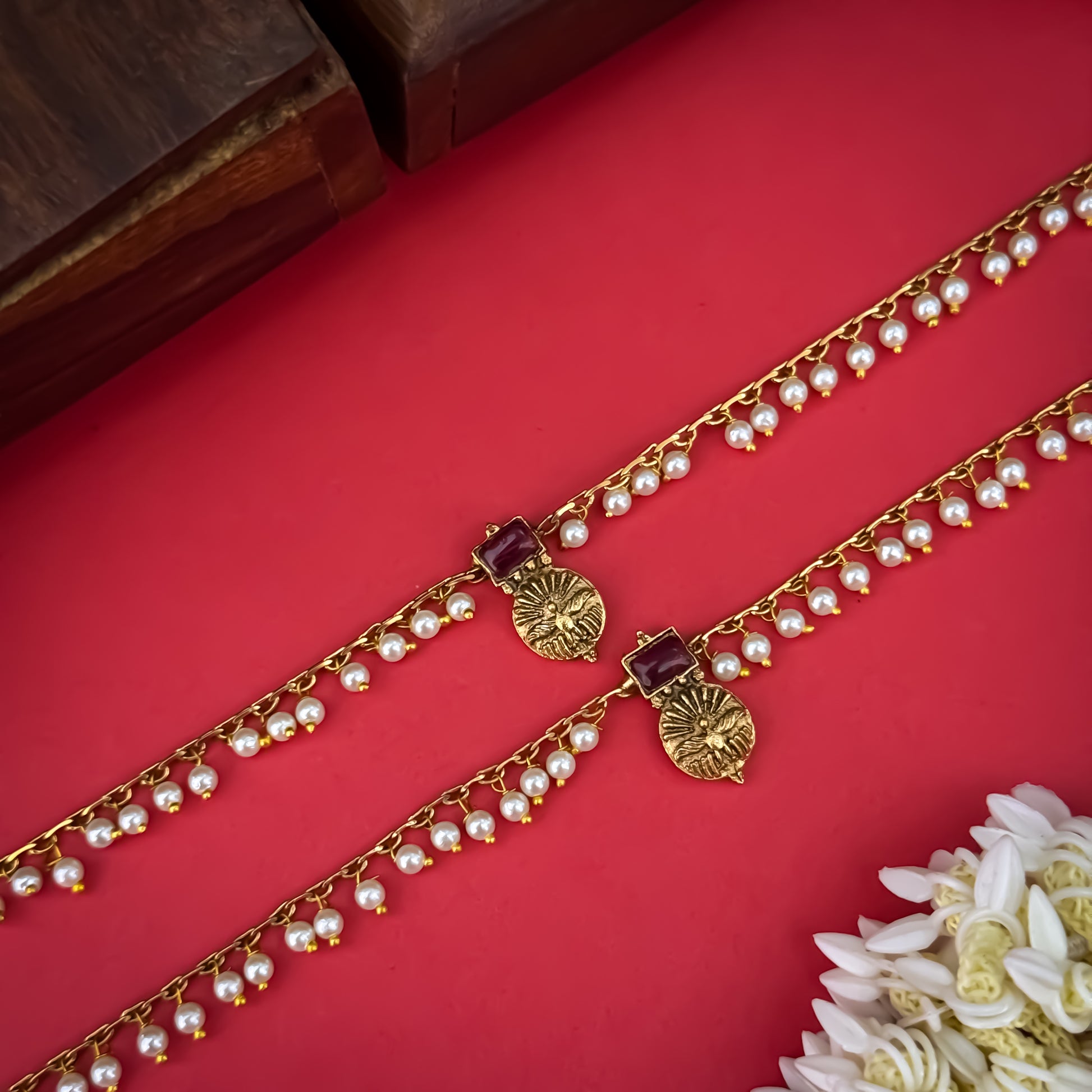 Floral Temple premium antique gold anklet pair featuring flexible double strand woven chain bands linked circular ruby pink and green kemp stone rosettes and cascading gold ghungroo fringes