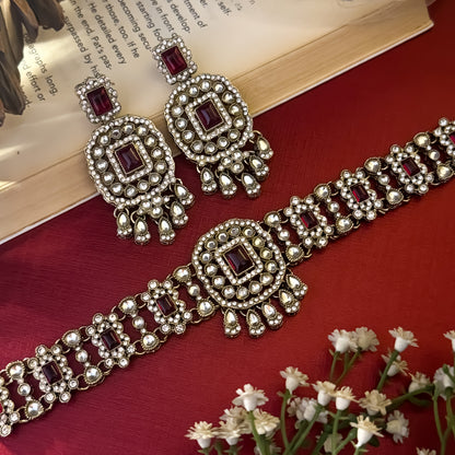 Ruhanika premium antique gold kundan broad choker necklace set featuring a segmented panel collar tracking of rectangular pastel pink quartz stones a large central rounded rectangular medallion matching tiered dropdown earrings