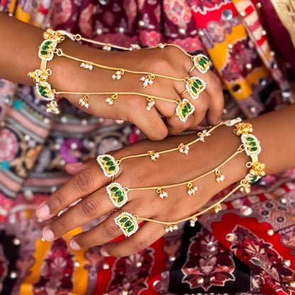 Kamaltika adjustable brass three finger haathphool pair featuring emerald green enameled lotus charms with small hanging seed pearls