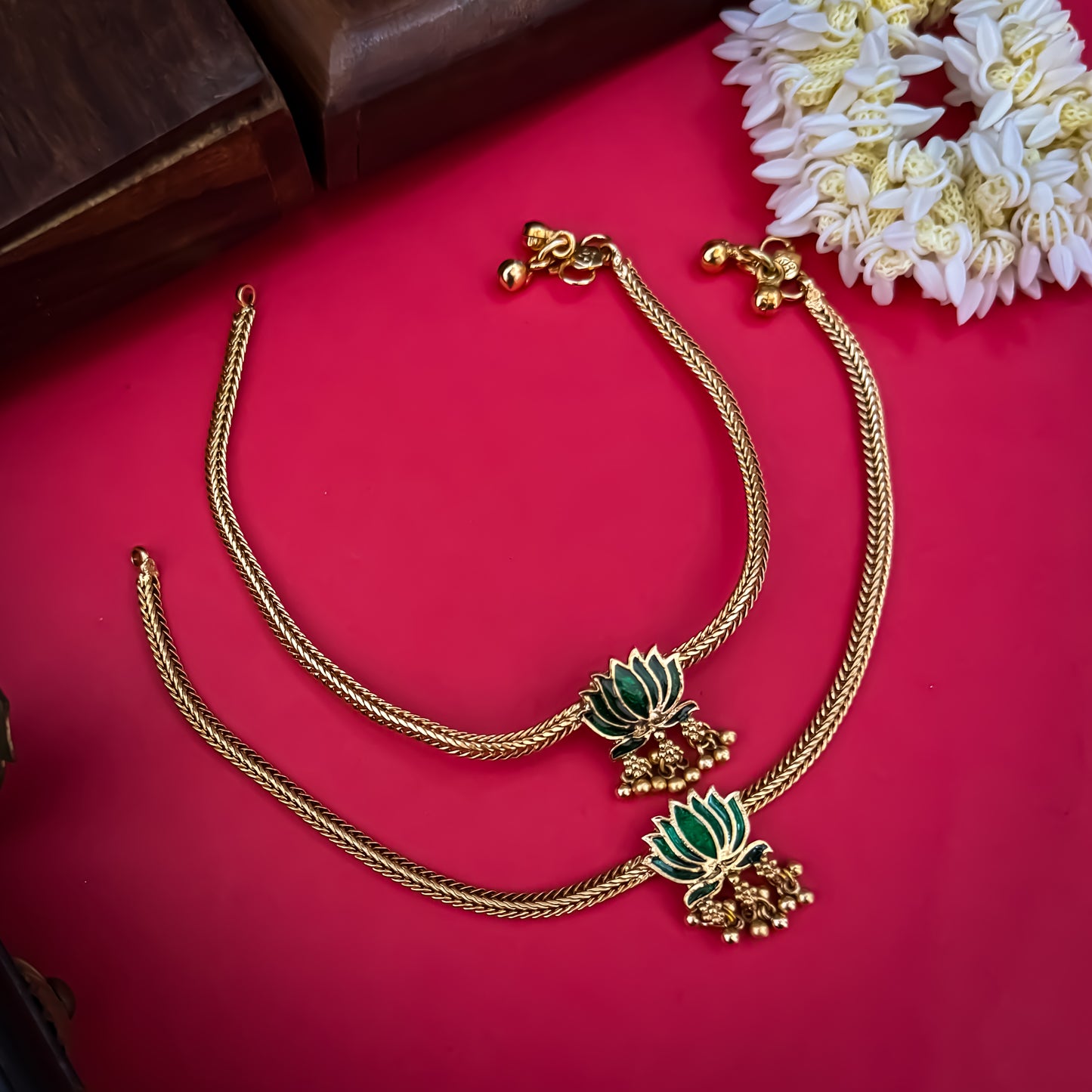 Lotus Bairagi premium antique gold temple anklet pair featuring flexible double strand woven rope chains a hand painted pink meenakari lotus flower centerpiece and dangling gold ghungroo bell clusters