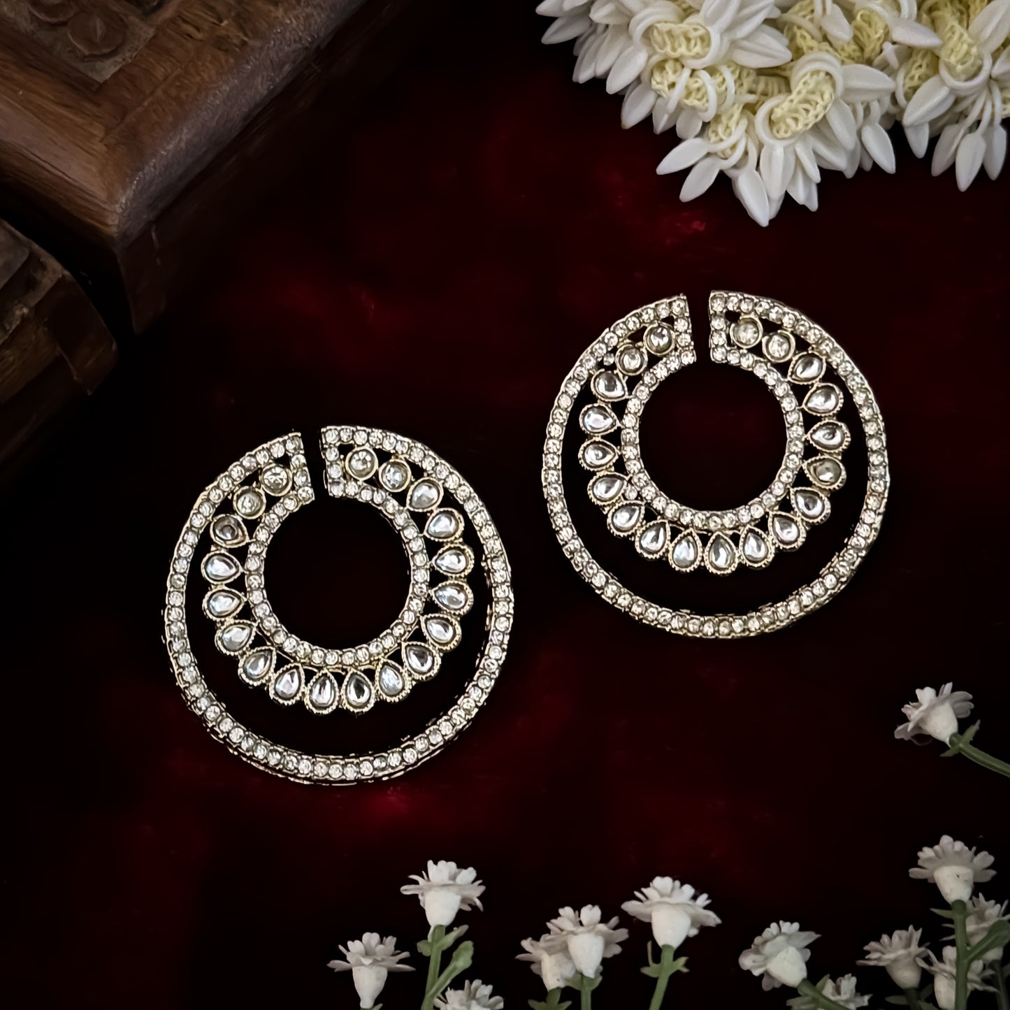 Rabiya premium antique gold kundan statement stud earrings featuring an open crescent circular geometry with concentric halos of teardrop stones and clear pavé crystals