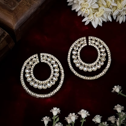 Rabiya premium antique gold kundan statement stud earrings featuring an open crescent circular geometry with concentric halos of teardrop stones and clear pavé crystals