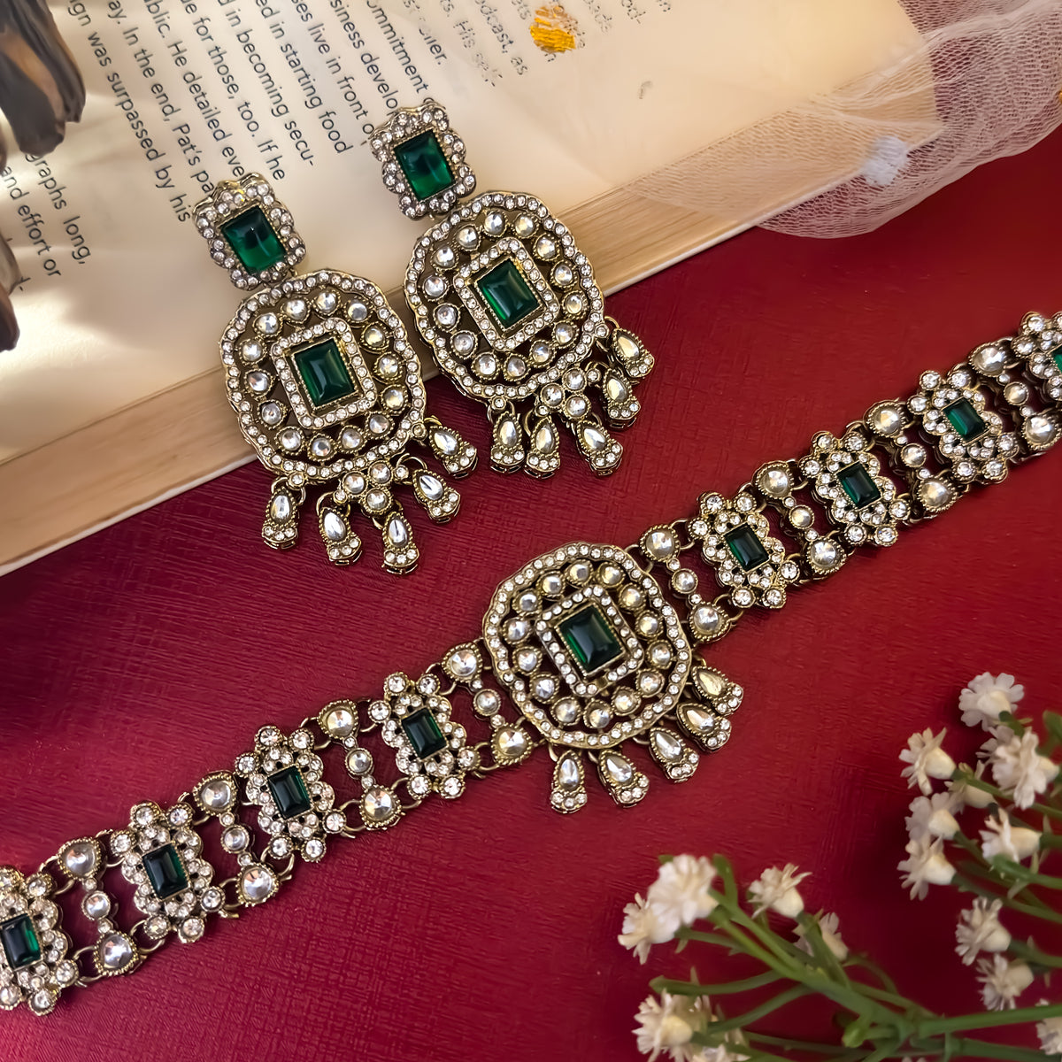 Ruhanika premium antique gold kundan broad choker necklace set featuring a segmented panel collar tracking of rectangular pastel pink quartz stones a large central rounded rectangular medallion matching tiered dropdown earrings