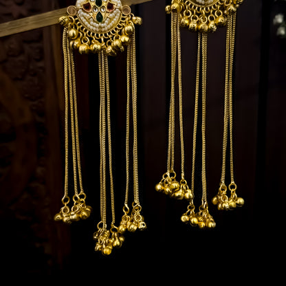 Nida premium kashmiri brass earrings featuring circular kundan studs with pink and green stones and long cascading gold ghungroo chains