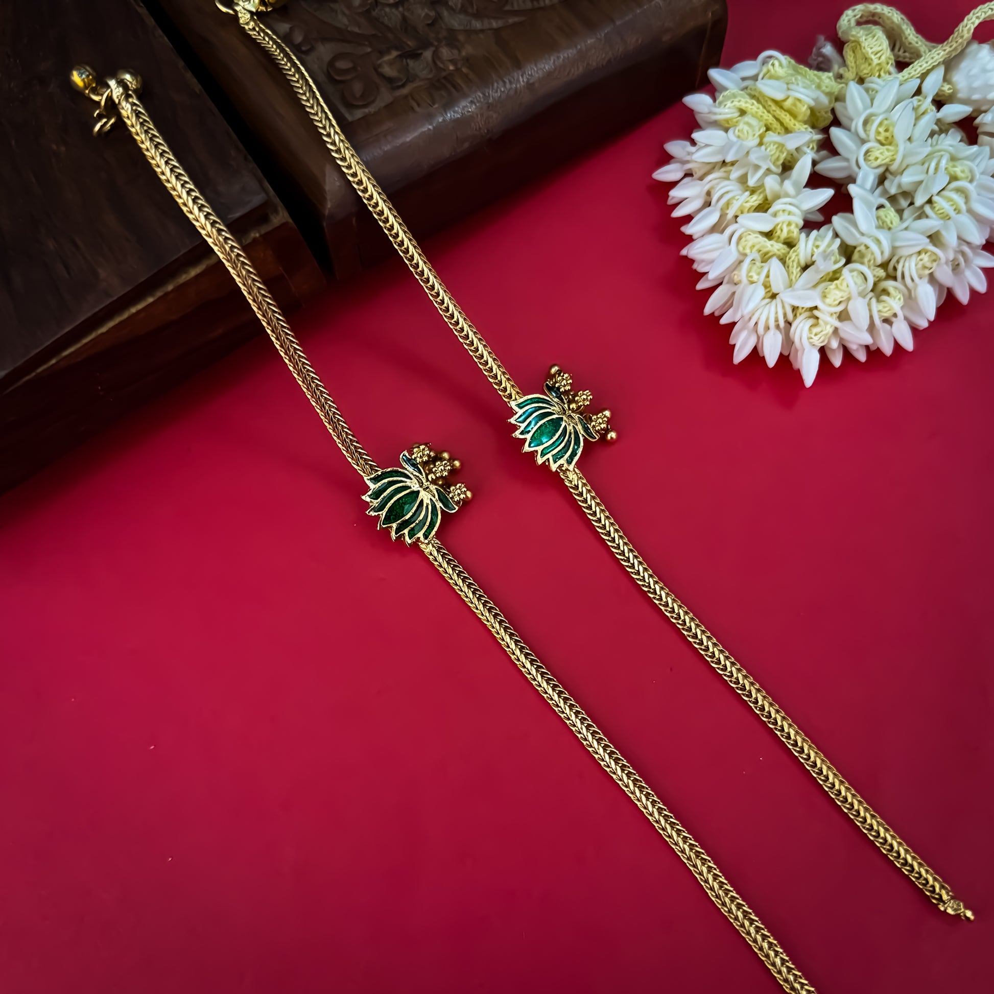 Lotus Bairagi premium antique gold temple anklet pair featuring flexible double strand woven rope chains a hand painted pink meenakari lotus flower centerpiece and dangling gold ghungroo bell clusters
