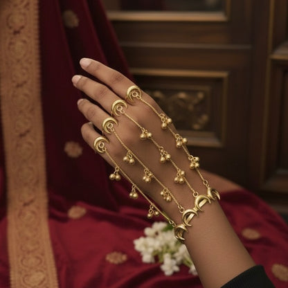 Chandani premium adjustable brass multi finger haathphool pair featuring matte gold crescent moon links and cascading ghungroo beads on a model