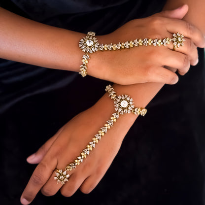 Christine premium american diamond haathphool piece featuring crystal chevron links and a round sunburst cz centerpiece on a matte gold finish