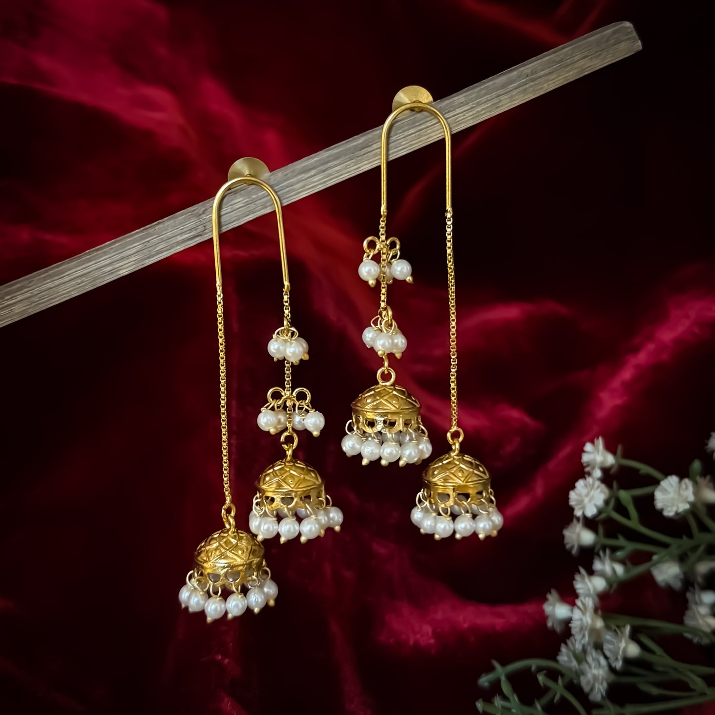 Isha Premium Kashmiri Brass Earrings featuring an elongated gold ear wire hook hanging two front tiered jhumka domes linked with pearls and a longer rear chain dome with a dense micro pearl fringe