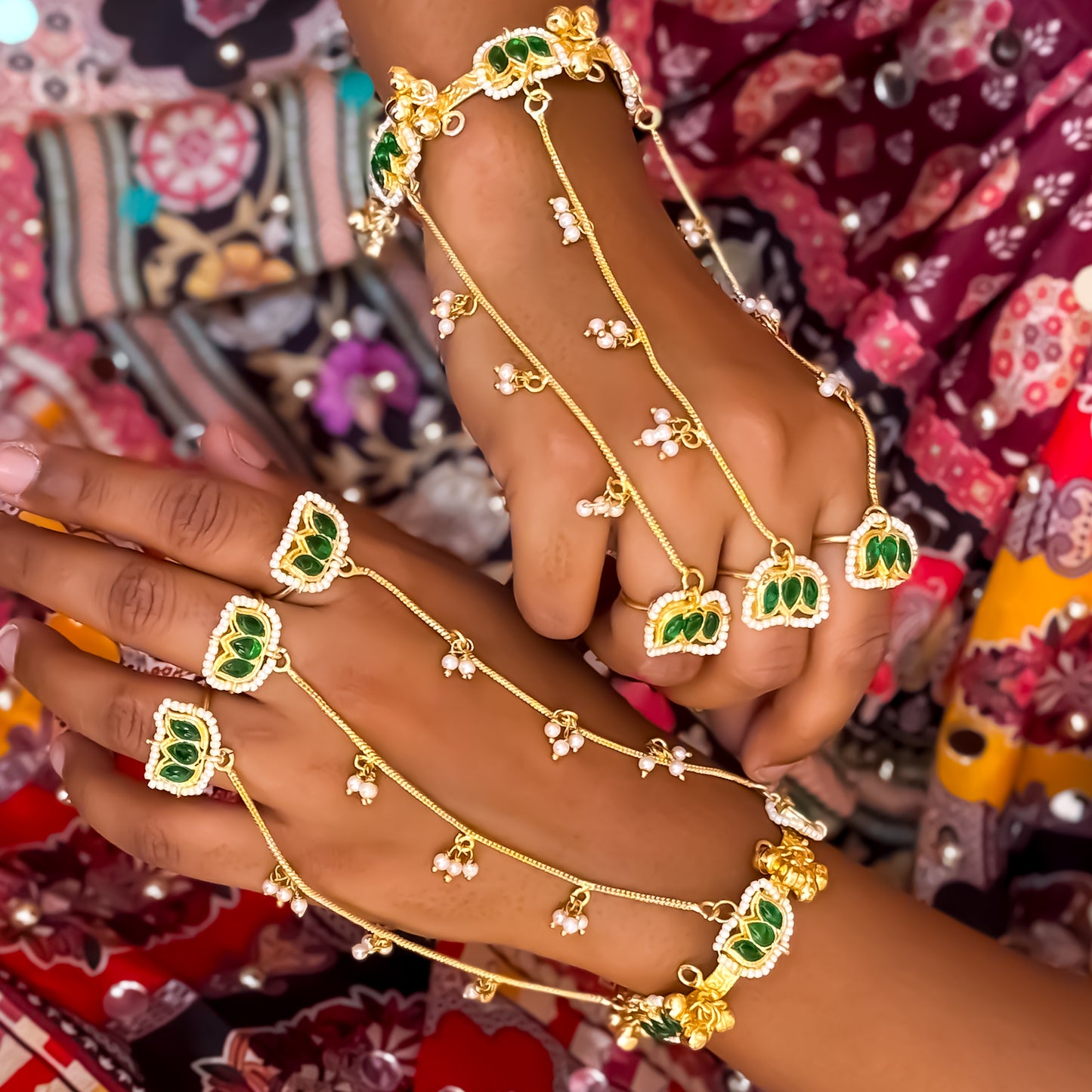 Kamaltika adjustable brass three finger haathphool pair featuring emerald green enameled lotus charms with small hanging seed pearls