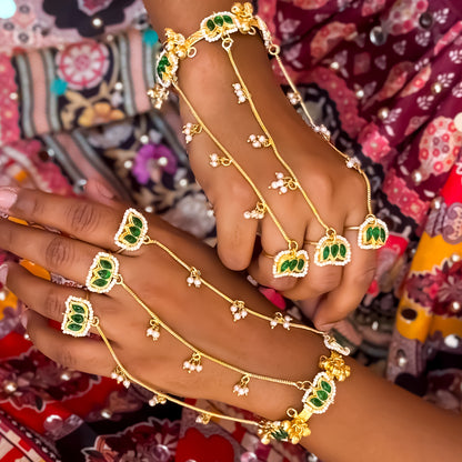 Kamaltika adjustable brass three finger haathphool pair featuring emerald green enameled lotus charms with small hanging seed pearls