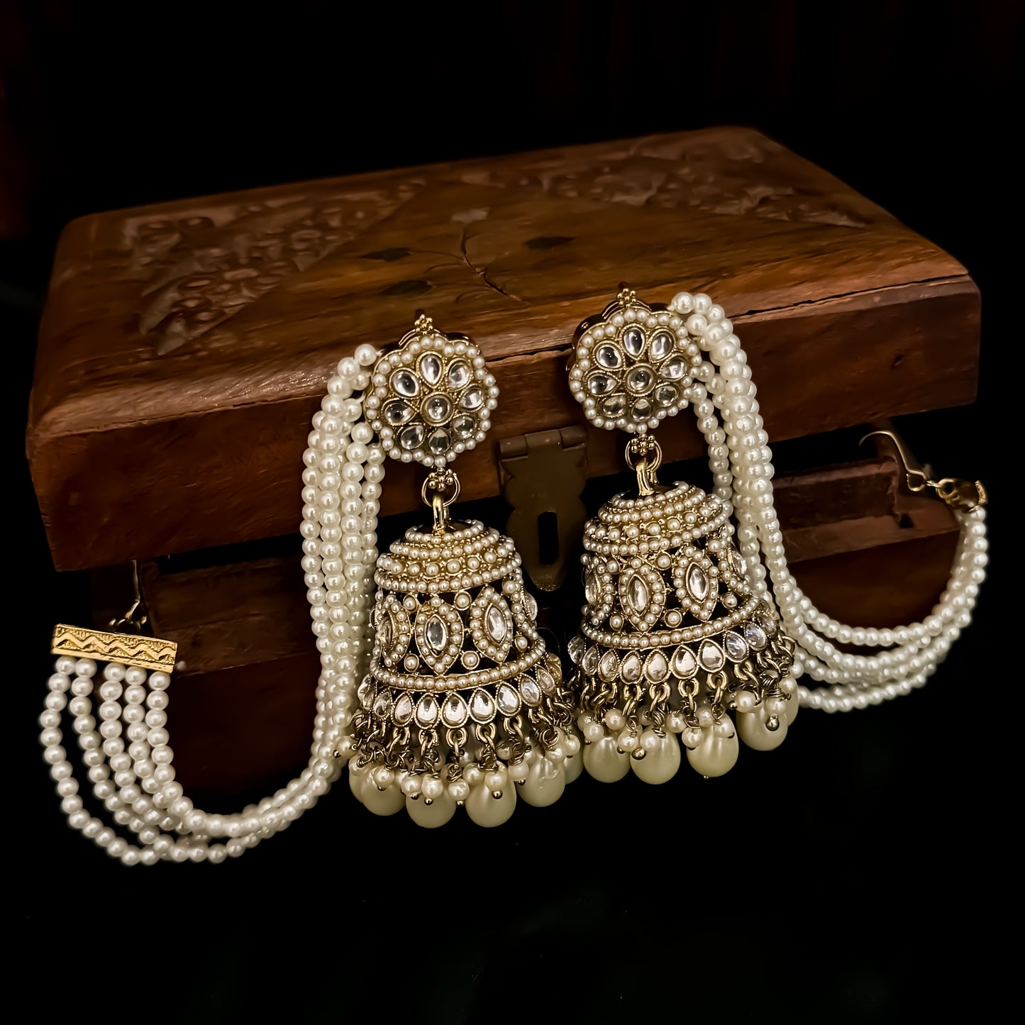 Traditional antique gold reverse american diamond bridal earrings featuring monochromatic white pearls with cascading teardrop drops and pearl sahara support chains