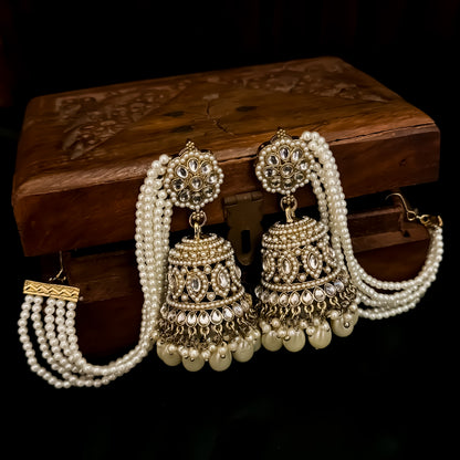 Traditional antique gold reverse american diamond bridal earrings featuring monochromatic white pearls with cascading teardrop drops and pearl sahara support chains
