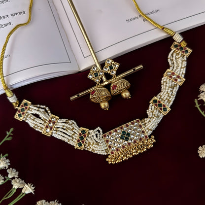 premium antique gold kundan necklace set featuring a multi strand tracking of white pearls and green beads a large central circular medallion with red and green stones and matching rectangular tiered drop earrings