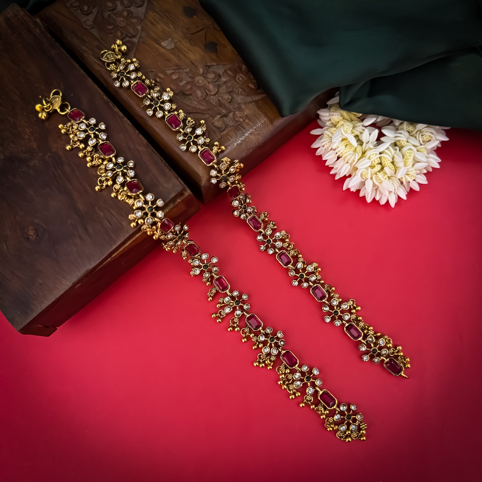 Floral Temple premium antique gold anklet pair featuring flexible double strand woven chain bands linked circular ruby pink and green kemp stone rosettes and cascading gold ghungroo fringes