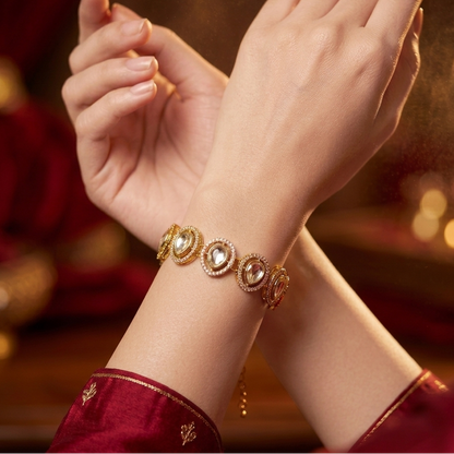 Jinisha adjustable antique gold polki bracelet featuring alternating oval and teardrop links with clear cz pave halos