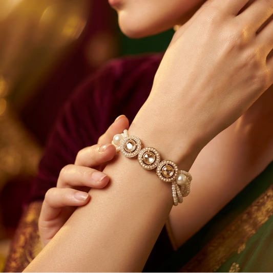 Akanksha adjustable antique gold bracelet featuring three round jadau kundan medallions and a five strand micro pearl band