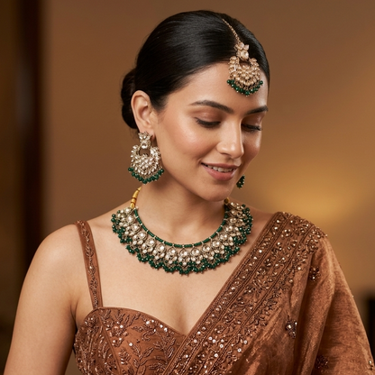 Harleen premium antique gold kundan broad choker necklace set featuring multi layered clear dabi stones and a dense cascading fringe of forest green beads with matching chandelier earrings