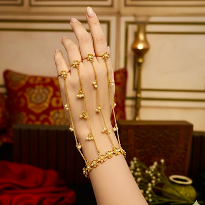 Jahan premium adjustable brass multi finger haathphool pair featuring matte gold delicate multi strand chains and ghungroo beads on a model