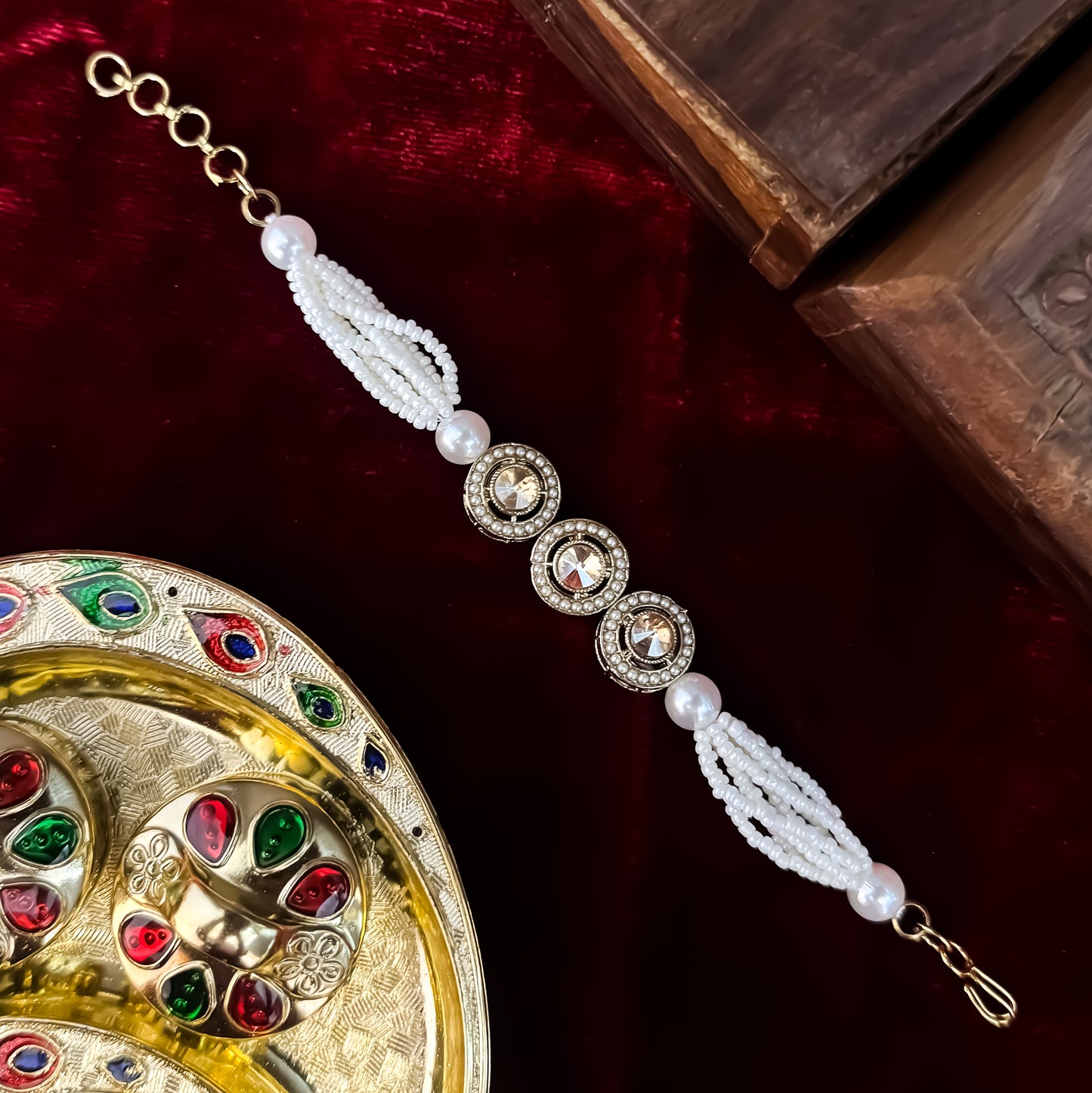 Akanksha adjustable antique gold bracelet featuring three round jadau kundan medallions and a five strand micro pearl band