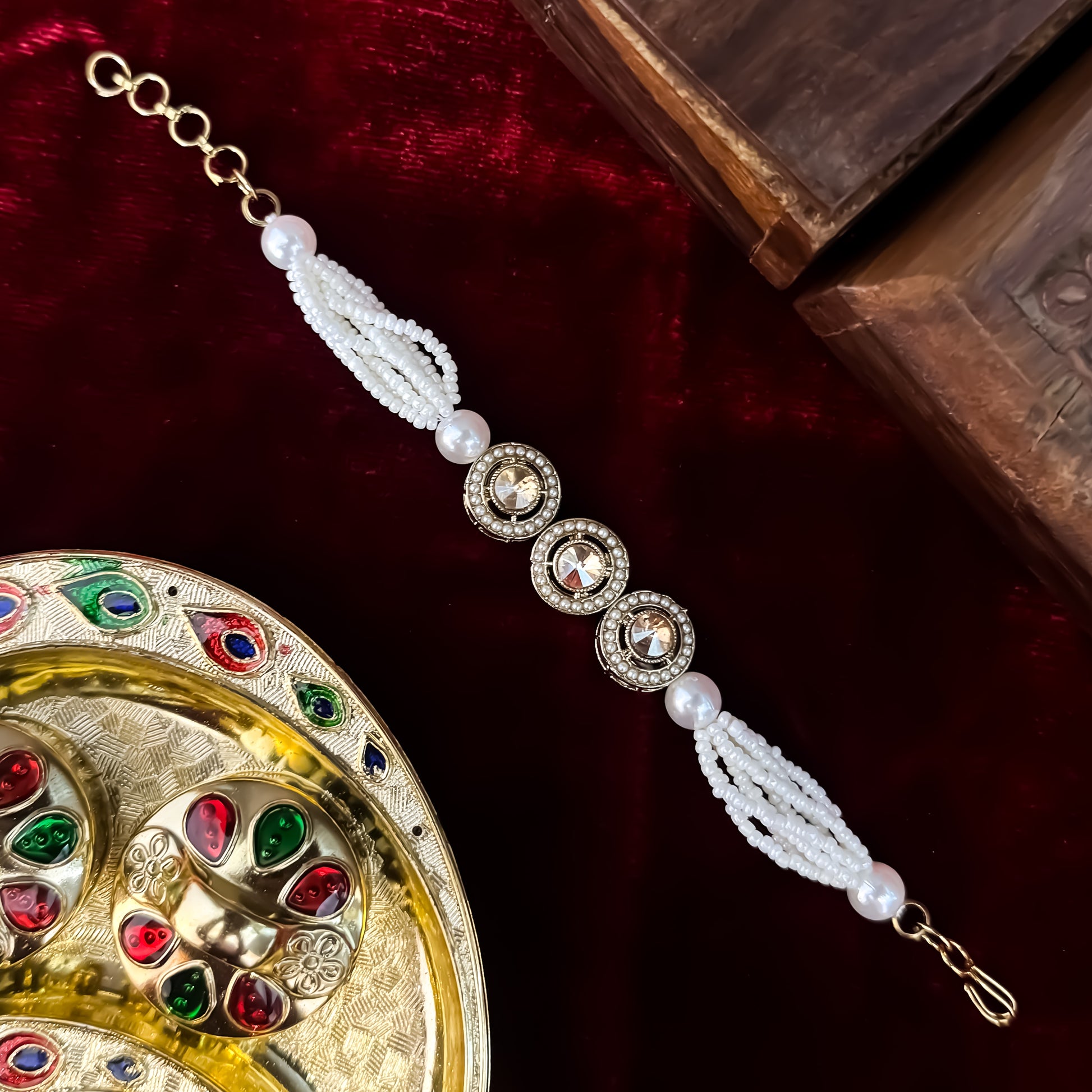 Akanksha adjustable antique gold bracelet featuring three round jadau kundan medallions and a five strand micro pearl band