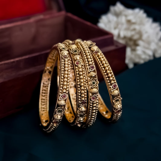 Madhurika Temple Gold Bangles with Ruby & Emerald Stones - Set of 4