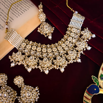 Maisha premium antique gold kundan broad choker necklace set featuring linked tracks of clear dabi stones a dense cascading fringe of pastel pink and mint green quartz beads with matching tiered earrings and maang tikka