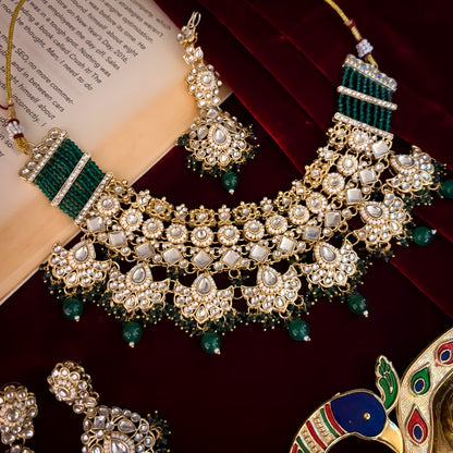 Maisha premium antique gold kundan broad choker necklace set featuring linked tracks of clear dabi stones a dense cascading fringe of pastel pink and mint green quartz beads with matching tiered earrings and maang tikka