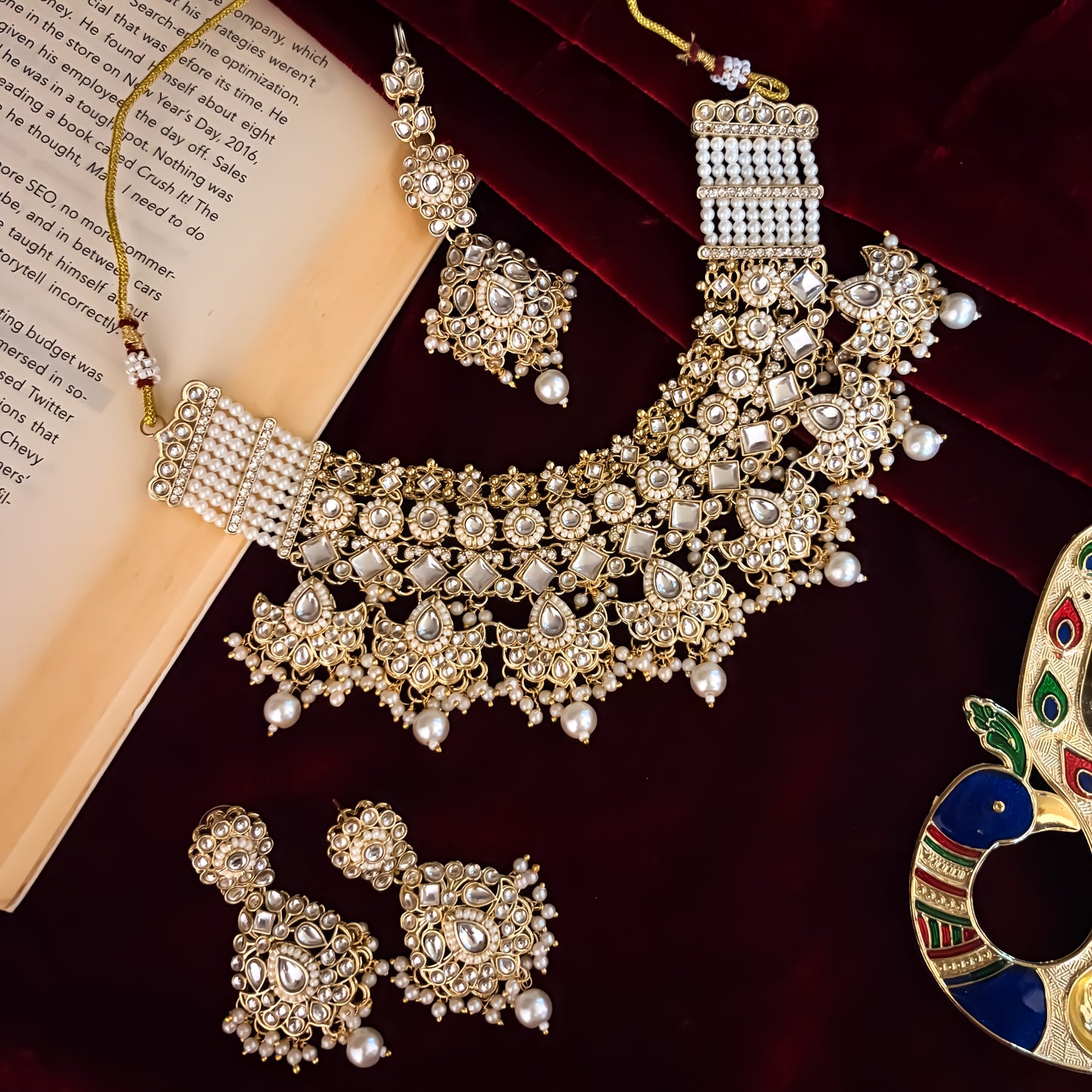Maisha premium antique gold kundan broad choker necklace set featuring linked tracks of clear dabi stones a dense cascading fringe of pastel pink and mint green quartz beads with matching tiered earrings and maang tikka
